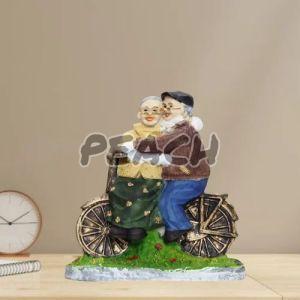 Romantic Dada Dadi Love Couple Statue On Cycle