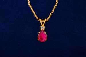 ladies ruby teardrop gold plated chain pendant