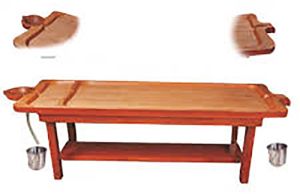 traditional wooden panchakarma massage table