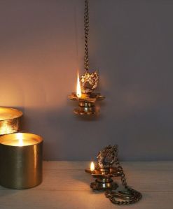 Brass Diya With Peacock Carved Hanging