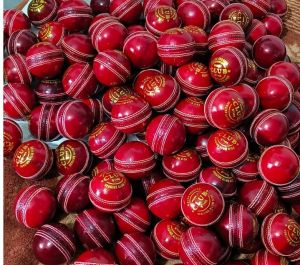 Red and White Leather Cricket Ball