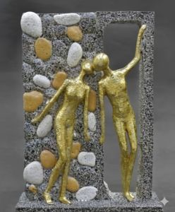 Gold Toned Human Figures Set within a Textured Stone  Frame.