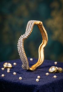 Gold Plated American Diamond Studded Wavy Bangle