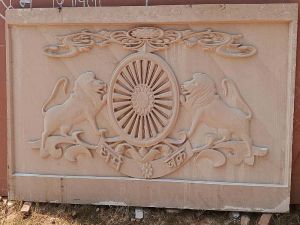 Dharma Chakra Carved Sandstone Wall Panel