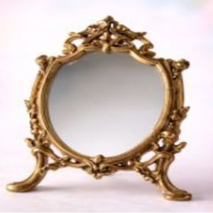 Leg On Golden Mirror Frame