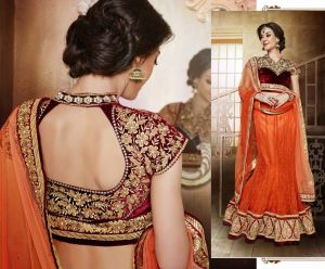 Orange wedding lehenga with heavy worked maroon choli