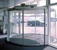 Automatic systems for curved sliding doors
