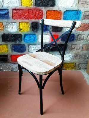 Metal crossback chair with distressed wood