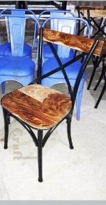 Metal crossback chair with old furnished wooden top