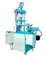 Vertical Plunger Injection Moulding Machine.