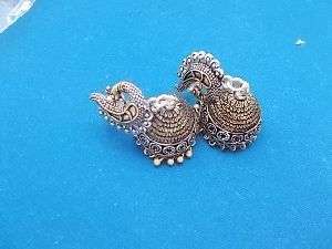 dual tone german silver jhumkas earrings