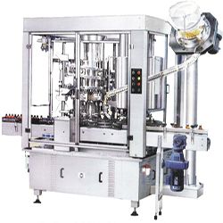 VOLUMETRIC FILLING CUM R.O.P.P. CAPPING MACHINE