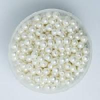 white plastic pearl beads
