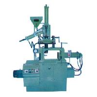 vertical plunger type injection moulding machine