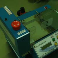 Diagnostic test strip cutting machine