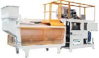 Puffed grain machine