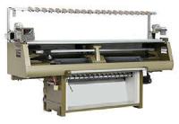 computerized flat bed knitting machine